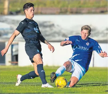  ??  ?? Above: Cowden’s Robbie Buchanan slides in on Jesse Curran; right: Jean Mendy modelling Dundee’s new away kit which was unveiled yesterday.