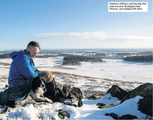  ??  ?? Edward Lathbury and his dog Ash look out over Bradgate Park. Picture: Joe Giddens/PA Wire