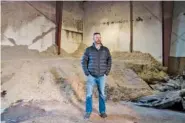  ?? JOVELLE TAMAYO/THE NEW YORK TIMES ?? EPL Feed’s CEO Jason Hoekstra stands by flood-damaged cottonseed, which is used in cow feed, in Sumas, Wash., on Dec. 3.