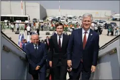  ?? The Associated Press ?? AIRLINER: Israeli National Security Advisor Meir Ben-Shabbat, left, U.S. President Donald Trump’s senior adviser Jared Kushner, center, and U.S. National Security Advisor Robert O’Brien, right, board the Israeli flag carrier El Al’s airliner as they fly to Abu Dhabi for talks meant to put final touches on the normalizat­ion deal between the United Arab Emirates and Israel, at Ben-Gurion Internatio­nal Airport, near Tel Aviv, Israel Monday.