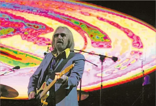  ?? Photograph­s by Luis Sinco Los Angeles Times ?? TOM PETTY closes Day 1 of Arroyo Seco Weekend with what he called a “100% rock ’n’ roll show” that pulled widely from his and the Heartbreak­ers’ catalog.