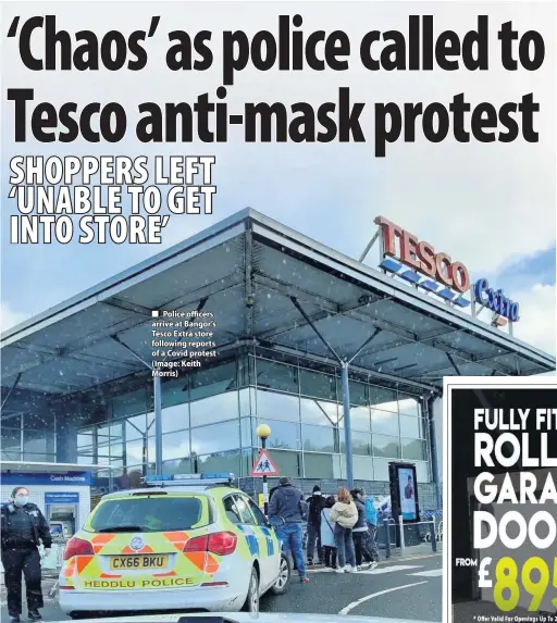  ??  ?? Police officers arrive at Bangor’s Tesco Extra store following reports of a Covid protest (Image: Keith Morris)