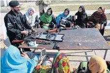  ??  ?? IN THE LINE OF FIRE: Teachers in Pakistan’s northwest frontier have been given special permission to carry concealed firearms to counter Islamist militants, but the notion is raising a storm of protest.