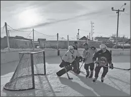  ?? Photo courtesy Jackie Hrabok ?? ON THE ICE — Nome’s hockey players met for the last of 52 games this season at the outdoor rink on April 20.