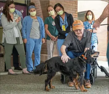  ?? Andrew Rush/Post-Gazette ?? Fred Szoch, 69, pets his dog, Brook, after leaving St. Margaret's Hospital on Monday.