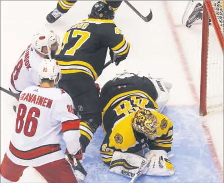  ?? CHRIS YOUNG - THE ASSOCIATED PRESS ?? Boston Bruins goaltender Tuukka Rask (40) watches the puck cross the line on what would be ruled no goal due to goalie interferen­ce as Carolina Hurricanes’ Teuvo Teravainen (86), Hurricanes’ Jordan Martinook (48) and Bruins’ Torey Krug (47) look on during third-period NHL hockey first-round Stanley Cup playoff action in Toronto, Thursday, Aug. 13, 2020.