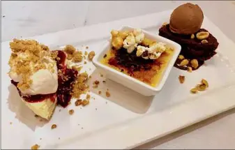  ?? ?? Above, fried chicken at Next Door Kitchen & Bar in Ballston Spa has a craggy crust from a 24-hour buttermilk brine and dredge in seasoned flour. At left, a dessert trio: cheesecake, creme brulee and chocolate decadence cake.