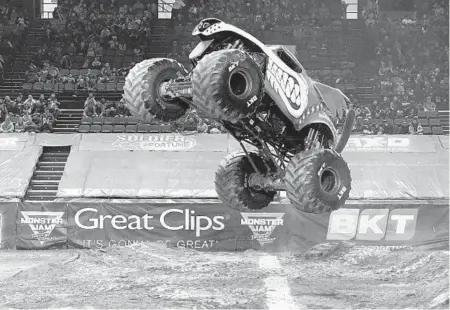  ?? KARL MERTON FERRON/THE BALTIMORE SUN ?? Monster Mutt, driven by Aaron Basl, goes airborne during Monster Jam Baltimore on Friday night at royal Farms Arena.