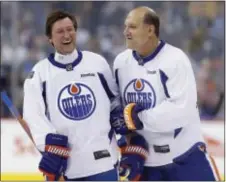  ?? ASSOCIATED PRESS FILE PHOTO ?? Dave Semenko, right, shown here in October with Wayne Gretzky during a practice for the NHL’s Heritage Classic Alumni game in Winnipeg, Manitoba has died. He was 59.