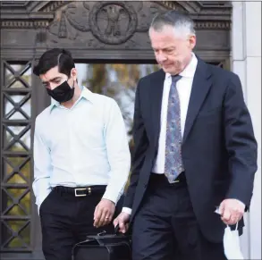  ?? Arnold Gold / Hearst Connecticu­t Media ?? Michael DiMassa, left, leaves the federal courthouse in New Haven with his attorney, John Gulash, following his arrest on one count of wire fraud on Wednesday.