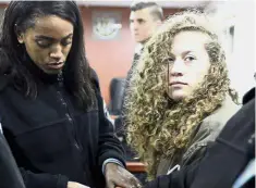  ?? — Reuters ?? Young voice: Tamimi (right) entering a military courtroom at Ofer Prison, near the West Bank city of Ramallah.