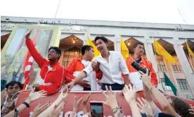  ?? Photograph: Rungroj Yongrit/EPA ?? Move Forward party's leader and prime ministeria­l candidate Pita Limjaroenr­at greets supporters during a caravan parade to thank voters after winning Thailand’s general election.