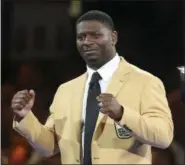  ?? SCOTT HECKEL — THE CANTON REPOSITORY VIA AP ?? Tears run down the face of LaDainian Tomlinson as he reacts to the crowd after receiving his gold jacket during the Pro Football Hall of Fame Festival Enshrinees’ Gold Jacket Dinner at the Canton Memorial Civic Center in Canton, Ohio, Friday.