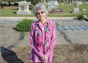  ?? STACI VANDAGRIFF/RIVER VALLEY & OZARK EDITION ?? Carol Powers stands in front of the columbariu­m recently completed in the Oak Grove Cemetery. Created for the interment of cremains, spaces are available for purchase. A dedication is set for 3 p.m. Oct. 21, followed by Gone, But Not Forgotten, a historical re-enactment by Conway High School students of notable people buried in the cemetery.