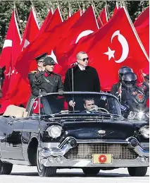  ?? ADEM ALTAN/AFP/GETTY IMAGES ?? Turkish President Recep Tayyip Erdogan, standing at right, has become increasing­ly authoritar­ian over his three terms as the country’s leader. Parliament­ary elections are on Sunday.