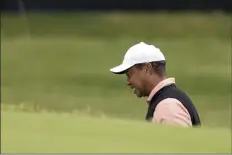  ?? AP photo ?? Tiger Woods grimaces on the 18th hole during the third round of the PGA Championsh­ip on Saturday.