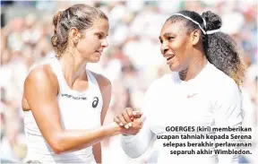  ??  ?? GOERGES (kiri) memberikan ucapan tahniah kepada Serena selepas berakhir perlawanan separuh akhir Wimbledon.