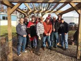  ?? EVAN BRANDT — MEDIANEWS GROUP ?? The volunteers who paid for, built and installed two benches at the Native American Memorial Site in Pottstown Dec. 23 pose for a photo.