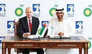  ??  ?? Sultan Ahmed Al-Jaber, right, ADNOC group chief executive officer and member of the Supreme Petroleum Council of the Emirate of Abu Dhabi, and Bob Dudley, BP group chief executive, sign an agreement in Abu Dhabi, Saturday. (AP)