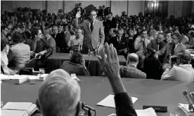  ?? Photograph: AP ?? Former White House aide John Dean is sworn in by the Senate Watergate committee chairman, Sam Ervinon, on 25 June 1973.