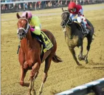  ?? PHOTO CHELSEA DURAND/NYRA ?? Monomoy Girl out in front to take Sunday’s Coaching Club American Oaks at Saratoga Race Course.
