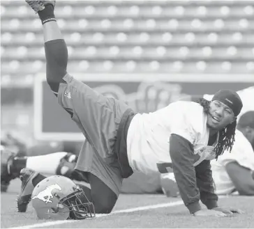  ?? Ted Rhodes/calgary Herald ?? Calgary Stampeders kick return specialist Larry Taylor stretches before practice at McMahon Stadium Wednesday. Taylor would like to return a punt against Winnipeg Friday.