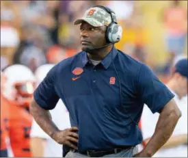  ?? MATTHEWHIN­TON - THE ASSOCIATED PRESS ?? In this Sept. 23, 2017, file photo, Syracuse head coach Dino Babers walks the sidelines during an NCAA college football game against LSU in Baton Rouge, La. Babers is in uncharted territory as he prepares for his seventh season as a head coach, and things are looking up.