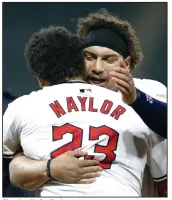  ?? (AP/Ron Schwane) ?? Cleveland’s Bo Naylor (23) celebrates his game-winning RBI single in the 10th inning with his brother, Josh Naylor, on Wednesday in the Guardians’ 7-6 victory. The Naylors added home runs in the fourth inning for Cleveland.