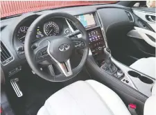  ??  ?? The Q60 Red Sport I-Line’s interior boasts a cool silver carbon-fibre trim.