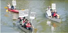  ?? TROY FLEECE ?? People in a kayak and two canoes made their feelings about spending cuts known at the Royal Regina Golf Club on Monday.