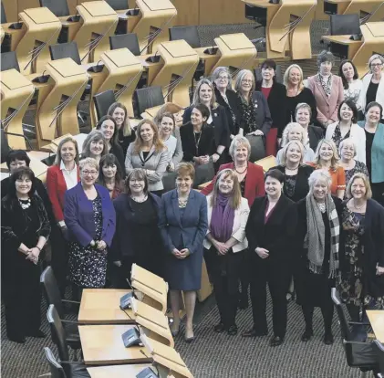  ??  ?? 0 Female Scottish MSPS, pictured in 2018, mark the 100th anniversar­y of women over 30 getting the vote