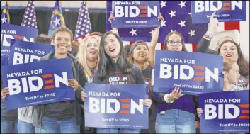  ?? Elizabeth Page Brumley Las Vegas Review-Journal @EliPagePho­to ?? Supporters chant for presidenti­al candidate former Vice President Joe Biden as he speaks during a caucus night event at IBEW local 357 in Las Vegas on Saturday.