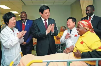 ?? LIU WEIBING / XINHUA ?? Top legislator Li Zhanshu visits patients on Wednesday who have undergone cataract surgery in Windhoek, Namibia, as part of the Brightness Journey campaigns, through which China has helped bring clear vision to many around Africa.