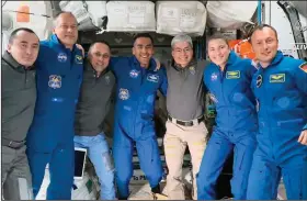  ?? (AP/NASA) ?? The Expedition 66 crew poses for a photo Thursday after the SpaceX Crew-3 flight’s arrival at the Internatio­nal Space Station.