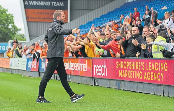  ??  ?? Dundee United manager Robbie Neilson thanks the fans who travelled down to Shrewsbury to watch their 2-1 pre-season friendly defeat.