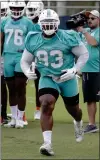  ?? LYNNE SLADKEY — AP ?? Defensive tackle Akeem Spence, going through a drill while in training camp with the Miami Dolphins, is being counted on by the Eagles to fill the void left by the injury to Tim Jernigan.