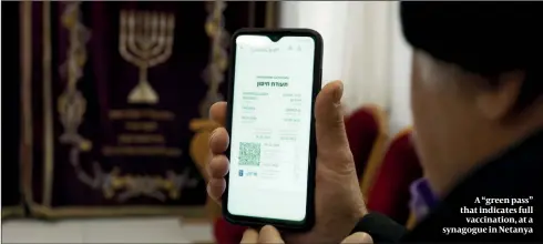  ?? PHOTO: GETTY IMAGES ?? A “green pass” that indicates full vaccinatio­n, at a synagogue in Netanya