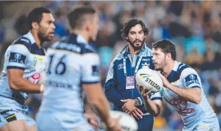  ?? Picture: GETTY IMAGES ?? Injured Johnathan Thurston looks on as the Cowboys warm up before their match last week.