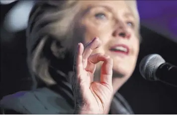  ?? ANDREW HARNIK THE ASSOCIATED PRESS ?? Democratic presidenti­al candidate Hillary Clinton speaks at a Women for Hillary fundraiser on Wednesday at the Hyatt Regency in Washington. Emails leaked on Friday cast Clinton as a savvy politician with connection­s to Wall Street that she is careful...