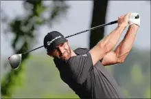  ?? MARK LENNIHAN/AP PHOTO ?? Dustin Johnson tees off on the 13th hole in the Northern Trust tournament at Liberty National Golf Course on Thursday in Jersey City, N.J.