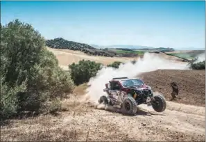  ??  ?? Khalifa Al Attiyah with co-driver Xavier Panseri in their Can-Am Maverick XRS in the T4 category on Thursday.