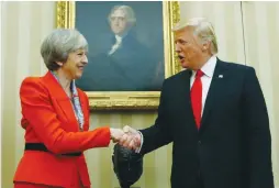  ?? (Kevin Lamarque/Reuters) ?? PRESIDENT DONALD TRUMP greets British Prime Minister Theresa May at the White House on January 27.