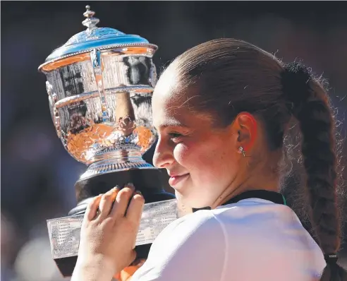  ?? Picture: JULIAN FINNEY/GETTY IMAGES ?? SHOCK RESULT: Jelena Ostapenko of Latvia lifts the Suzanne Lenglen Cup following her victory over Romania’s Simona Halep in the women’s singles final at the French Open at Roland Garros.