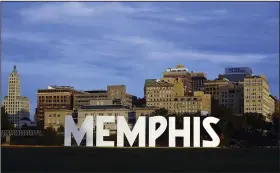  ?? (AP/Daily Memphian/Patrick Lantrip) ?? Downtown Memphis rises in the background behind the Memphis sign on Mud Island in 2020.