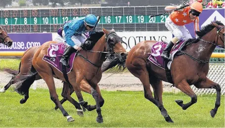  ??  ?? Bigrace success . . . Jockey Michael Coleman gestures in delight after winning the group 1 New Zealand 1000 at Riccarton Park on Saturday. Right: Auckland trainer Peter Williams clutches one of the guineas trophies