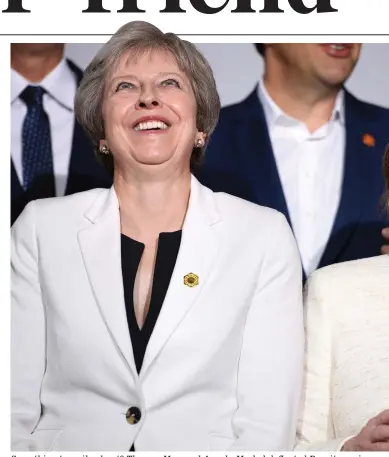  ??  ?? Something to smile about? Theresa May and Angela Merkel deflected Brexit queries