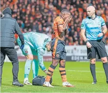  ?? ?? Top: Calum Butcher clashes with Christian Ramirez and Jeando Fuchs, above, leaves the field injured.