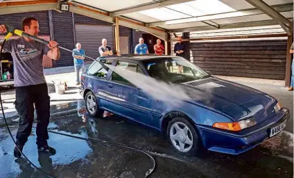  ??  ?? WATER POWER Richard rinses all the soap off a car with a jet wash; he leaves filtered water to dry, or uses a microfibre cloth