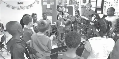  ??  ?? Web: Yocum Elementary second graders in Stacy Gulick’s class made a giant spider web after reading 'Anansi'