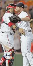  ?? STAFF PHOTOS BY STUART CAHILL ?? START TO FINISH: Brian Johnson allowed three runs in 41⁄ innings last night at Fenway and got a no-decision; Craig Kimbrel (right) gets congratula­tions from Sandy Leon after earning the save with another dominant ninth.